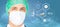 Surgeon in surgical mask and hat over charts