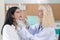 A surgeon uses a ruler to examine a patient in preparation for cosmetic surgery in doctors office. Cosmetology concept