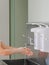 A surgeon washes his hands under a faucet in a stainless steel wash-hand basin. Preparing for a surgical operation