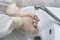 Surgeon washes and processes hands with rubber gloves