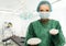 Surgeon woman holding silicon breast implants