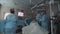 Surgeons perform operation looking at monitor at hospital