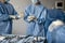 Surgeons prepare sterile medical instruments for surgery