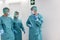 Surgeons preparing for surgical operation during coronavirus outbreak - Focus on left doctor