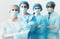 Surgeons Team Wearing Protective Uniforms, Standing In Row