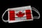 Surgical Masks With Canada Flag Printed Isolated on Black Background