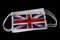 Surgical Masks With UK Flag Printed Isolated on Black Background