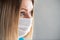 Surgical Nurse or doctor with face mask. Close up portrait of young caucasian woman model