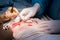 surgical suture. The hands of the surgeon and assistant in a sterile operating room impose a cosmetic suture on the skin of the