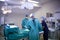 Surgical Team Working On Patient In Hospital Operating Theatre