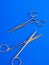 Surgical tools over blue background