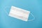Surgical white mask for protection on a blue background
