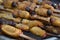 Suri - Amazonian grub that feeds on palm sap, grilled and served as a snack food in Iquitos, Peru