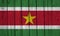 Suriname Flag Over Wood Planks