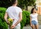 Surprise for her. Man hides flower bouquet behind back waits romantic date. Dating tips that will transform your love