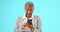 Surprise, wow and black woman on blue background with phone for social media, internet and mobile app. Communication