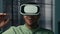 Surprised african american man in VR glasses in 3D digital metaverse world play online male gamer enjoying video game