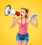 Surprised amazed pinup girl. Happy excited woman holding money and megaphone. Yellow background