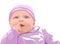 Surprised baby with blue eyes dressed in pink clothes. Holding finger in mouth