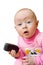 Surprised baby with cell phone, isolated