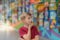 A surprised boy looks at paintings in an exhibition gallery