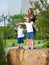 Surprised children show his hands on something