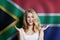 Surprised cute happy girl with South Africa flag background. Travel and learn english language concept