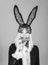 Surprised easter bunny woman wearing bunny ears and eat carrot. Happy easter and funny easter day. Smile easter.