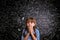 Surprised girl, hands on mouth, blackboard with mathematical symbols