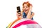 Surprised girl leans on an inflatable swimming ball and reads messages on the phone on a white background