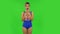 Surprised girl in a swimsuit is saying oh my god then wow. Green screen