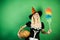 Surprised housekeeper wife with pumkin play and posing. Halloween wide banner with girl housekeeper. Costumes and