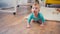 surprised infant boy crawling on floor