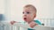 surprised infant boy standing in baby