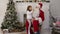 Surprised little girl checking upon Santa beard