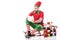 surprised man in christmas elf costume sitting on sleigh near pile of presents and looking at wishlist isolated