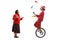 Surprised mature woman looking at a clown juggling and riding a unicycle