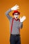 Surprised mime man in vest and red hat Isolated on orange background