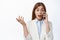 Surprised office woman ceo answer phone call, look amazed with disbelief, gasping astonished, white background