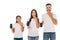 Surprised parents and kid holding smartphones