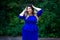 Surprised plus size fashion model in blue dress outdoors, beauty woman with professional makeup and hairstyle