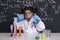 Surprised scientist girl with gloves in lab coat