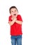 Surprised small boy with red shirt and jeans