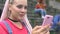 Surprised stylish teen girl reading good comment in social network account, app