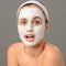 Surprised teenage girl looking camera face mask