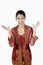 Surprised woman in baju kebaya with hands opened. Conceptual image