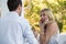 Surprised woman looking at man proposing her