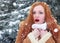 Surprised woman winter outdoor portrait, snowy fir trees background