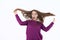 Surprised woman, woman in shock, surprise and flying hair. Blowing hair. Beautiful young girl posing in studio, emotions.