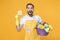 Surprised young man househusband in apron rubber gloves hold basin with detergent bottles washing cleansers doing